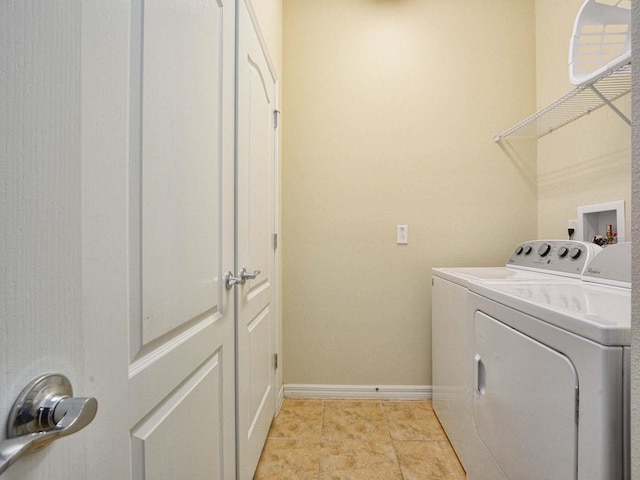 laundry room with light tile patterned floors and independent washer and dryer