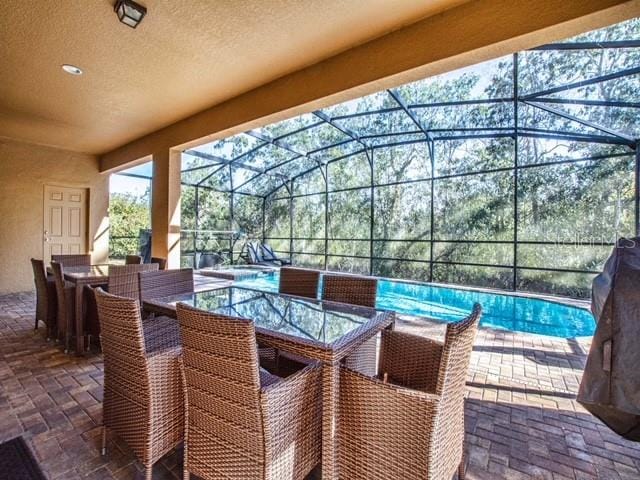 view of patio with a lanai