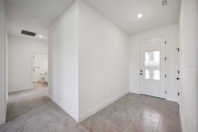 foyer entrance with light tile patterned floors, recessed lighting, visible vents, and baseboards