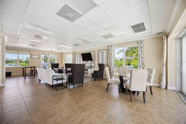 dining room featuring a paneled ceiling, visible vents, baseboards, and light tile patterned floors