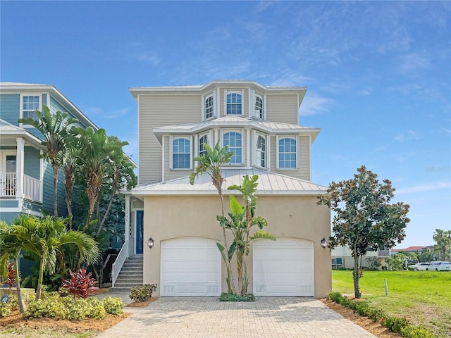 view of front of home with a garage