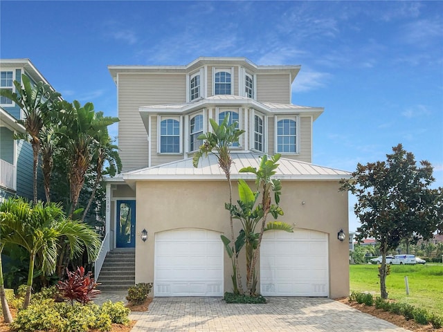 view of front of home with a garage