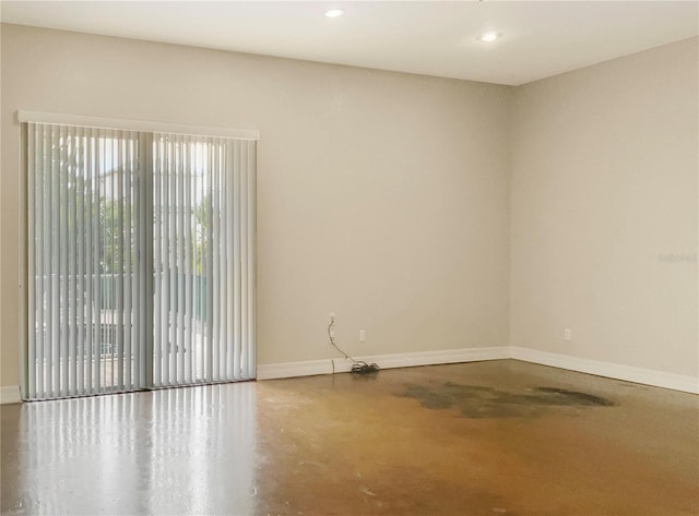 spare room with concrete flooring