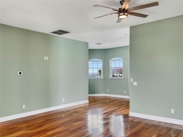 spare room featuring ceiling fan and wood-type flooring