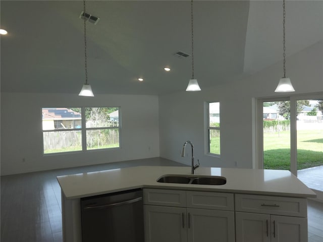 531 Rhodes Dr, Deland, FL 32720 - kitchen with stainless steel dishwasher, open floor plan, light countertops, white cabinets, and recessed lighting