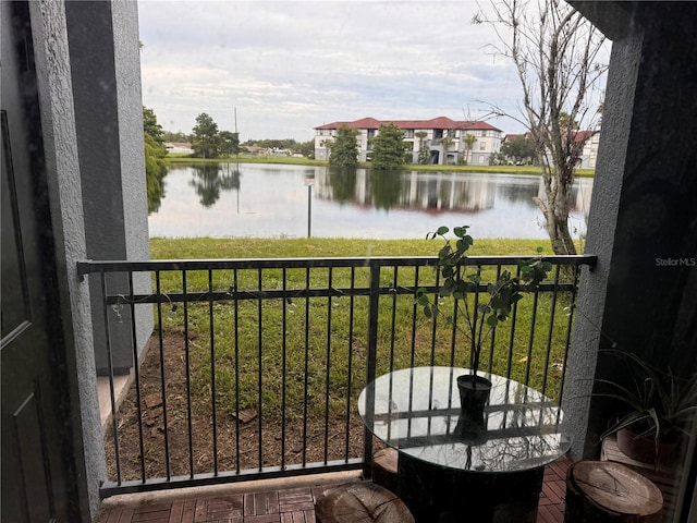 balcony featuring a water view