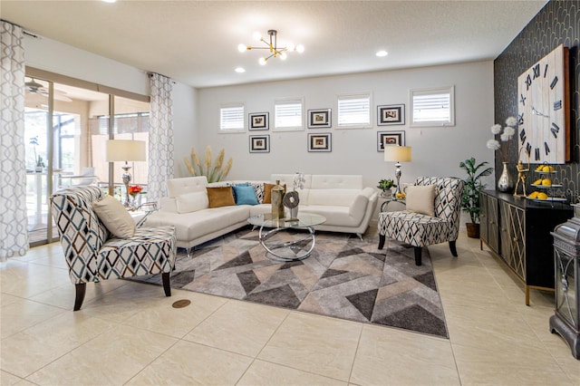 living room with a notable chandelier and light tile patterned flooring