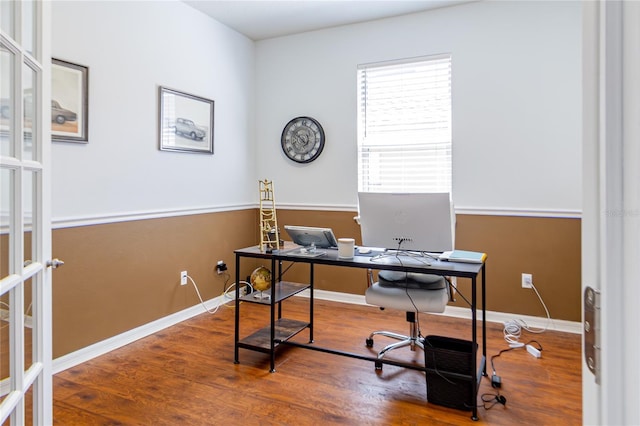 home office with hardwood / wood-style floors