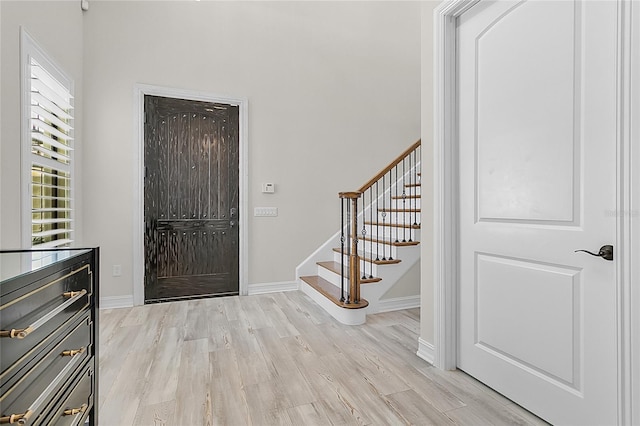 foyer entrance with light wood-type flooring