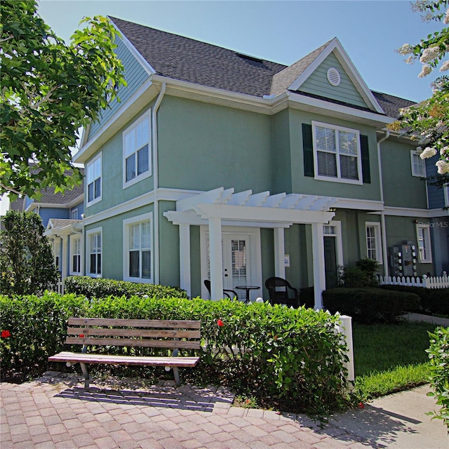 view of front of home with a pergola