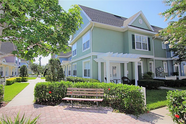 view of front of home with a pergola