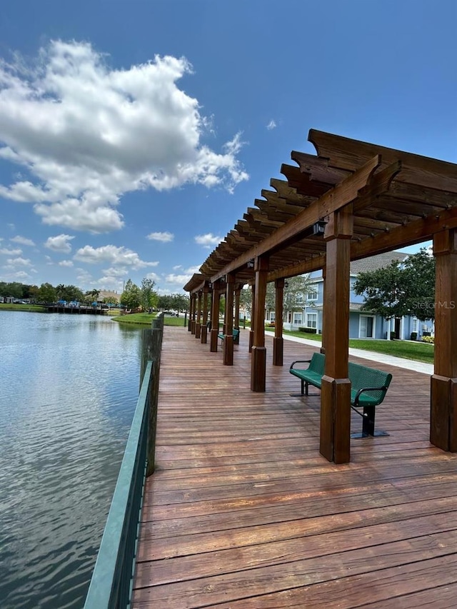 dock area featuring a pergola and a water view