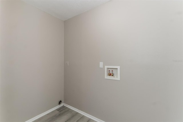 clothes washing area with hookup for a washing machine and hardwood / wood-style floors