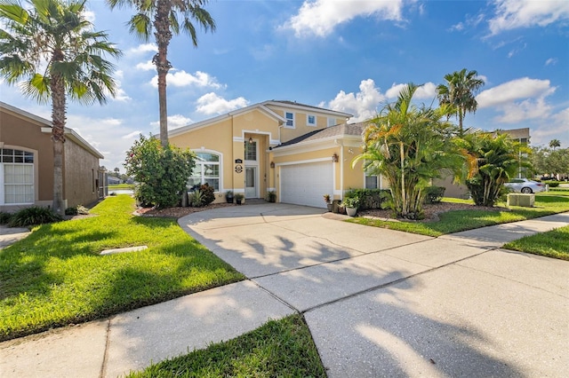 view of front of home with a garage and a front yard