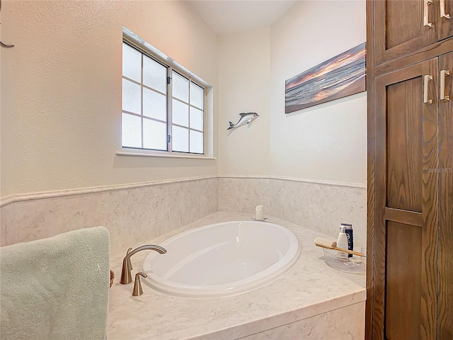 bathroom with tiled tub