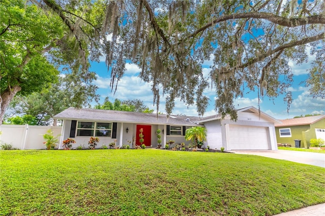 ranch-style home with a garage and a front yard