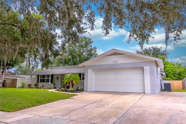 ranch-style house with a garage and a front lawn