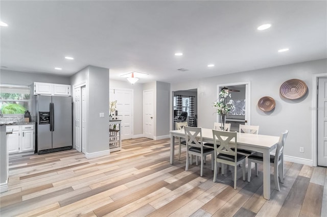 dining area with light hardwood / wood-style floors