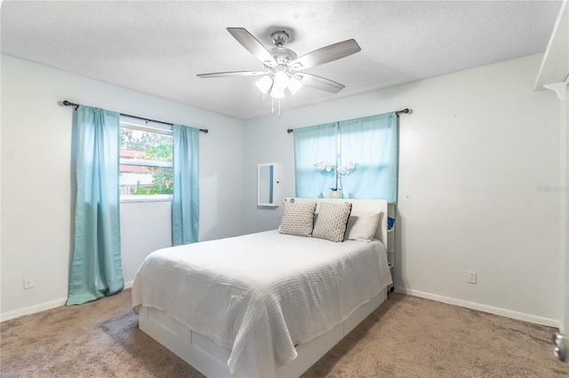 bedroom featuring light carpet and ceiling fan