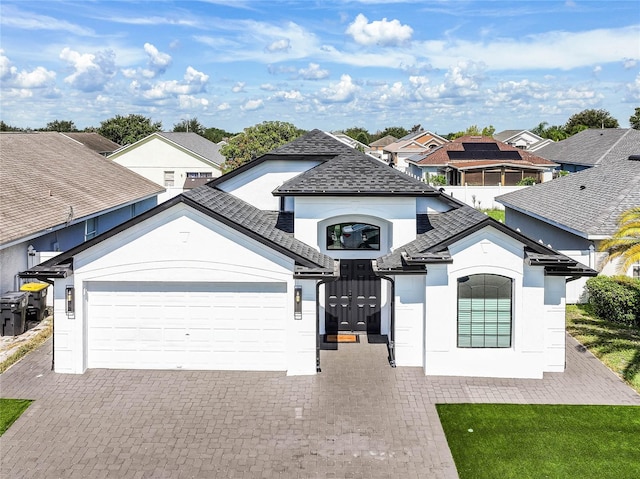 view of front of property with a garage