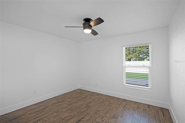 unfurnished room featuring dark hardwood / wood-style floors and ceiling fan