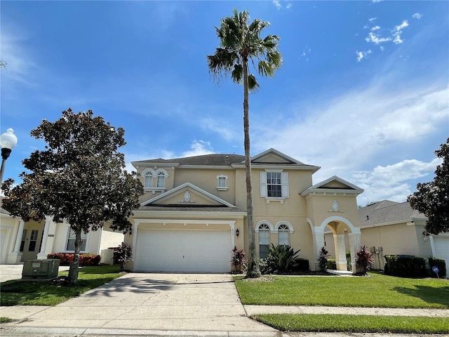 view of front of home featuring a garage and a front lawn