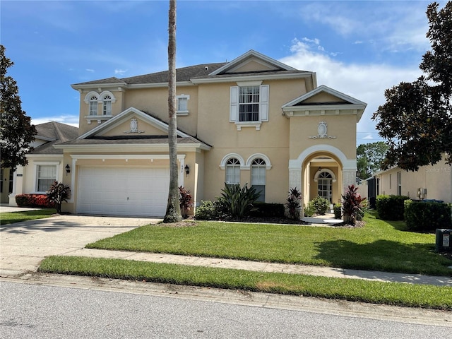 view of front of property featuring a garage and a front yard