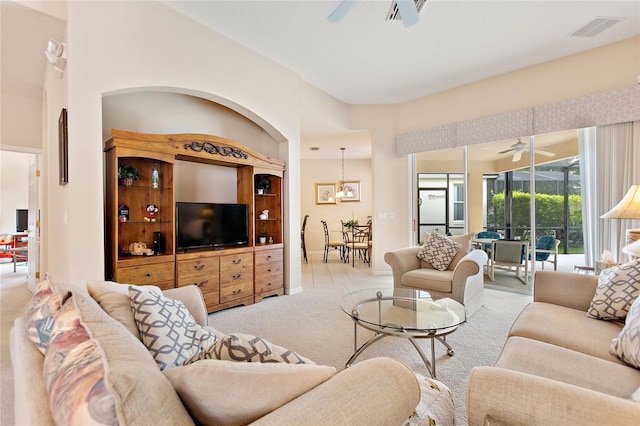 carpeted living room featuring ceiling fan