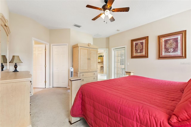 bedroom with light carpet and ceiling fan