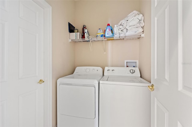 clothes washing area featuring washing machine and dryer