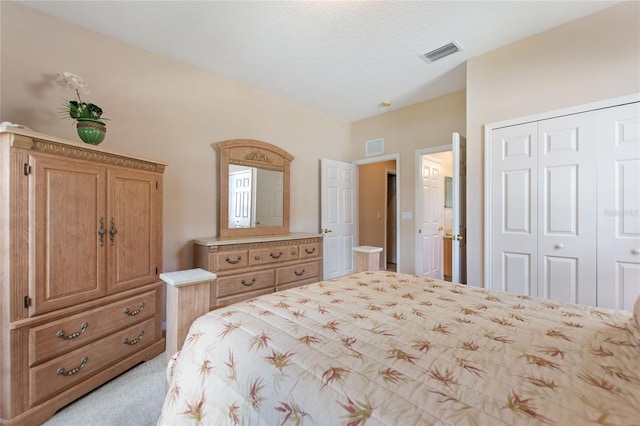 carpeted bedroom with a closet