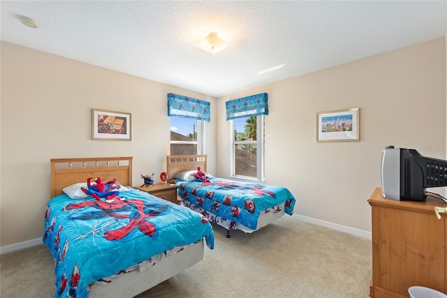 carpeted bedroom with a textured ceiling