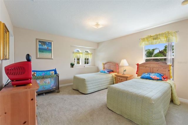 carpeted bedroom with a textured ceiling