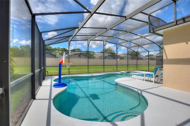 view of swimming pool featuring an in ground hot tub, a yard, a lanai, and a patio area