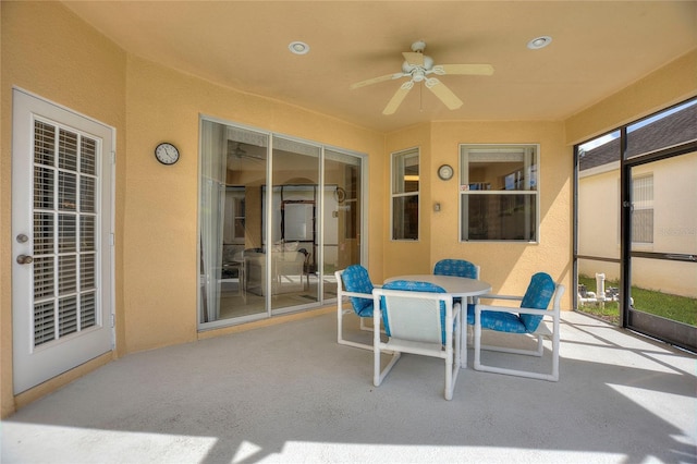 sunroom with ceiling fan