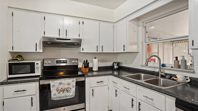 kitchen with stainless steel electric range, sink, white cabinetry, and dishwashing machine