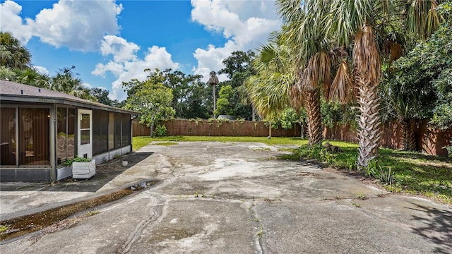 view of yard featuring a sunroom