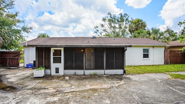 rear view of house with a sunroom