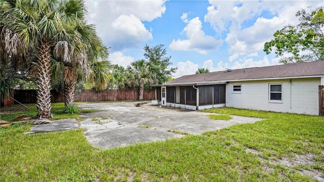 view of yard with a patio area and a sunroom