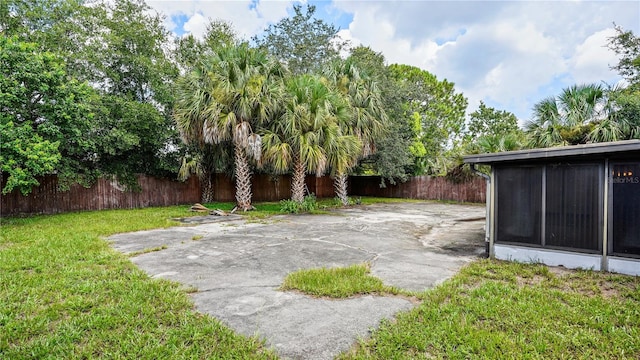 view of yard with a patio area and a sunroom