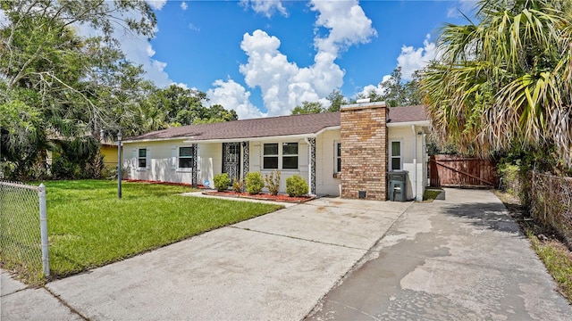 ranch-style house with a front yard