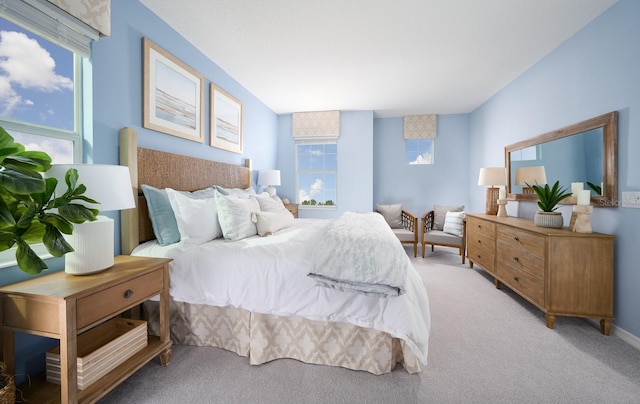 bedroom featuring light carpet