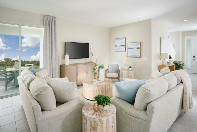 living room featuring light tile patterned floors and a wealth of natural light