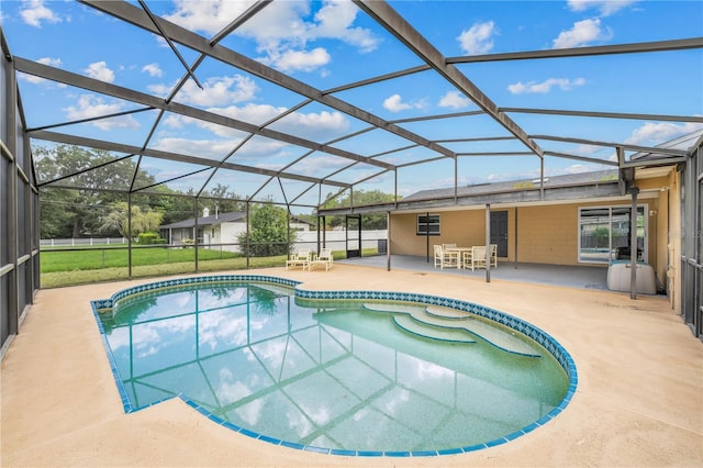 pool featuring a patio area, a lanai, and fence