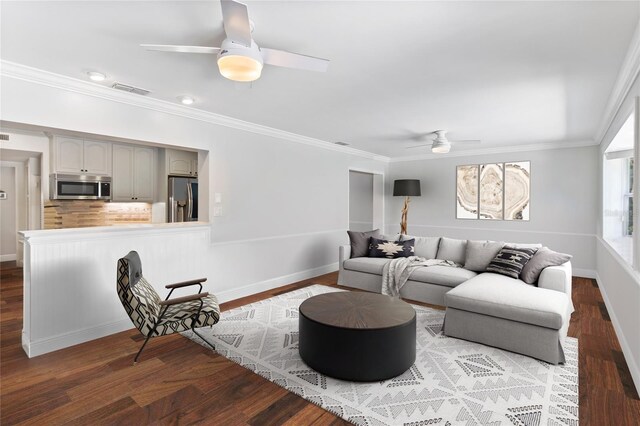 living room featuring ceiling fan, hardwood / wood-style floors, and crown molding