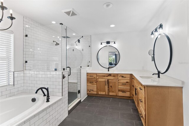 bathroom with dual vanity, shower with separate bathtub, and tile patterned flooring