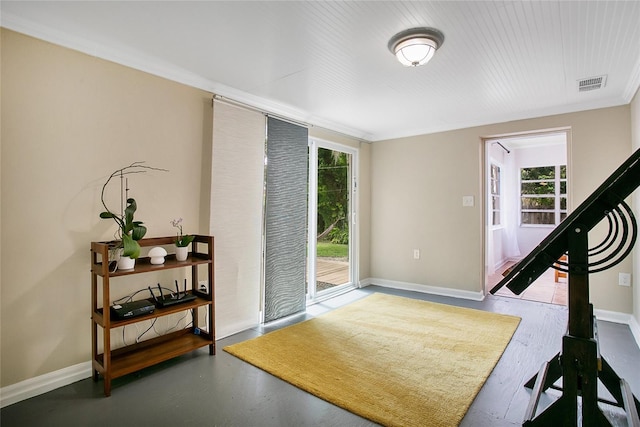 interior space featuring hardwood / wood-style flooring and crown molding