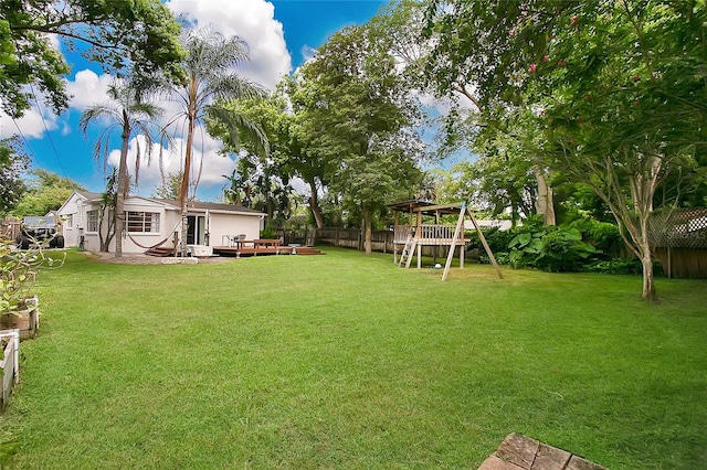 view of yard featuring a wooden deck