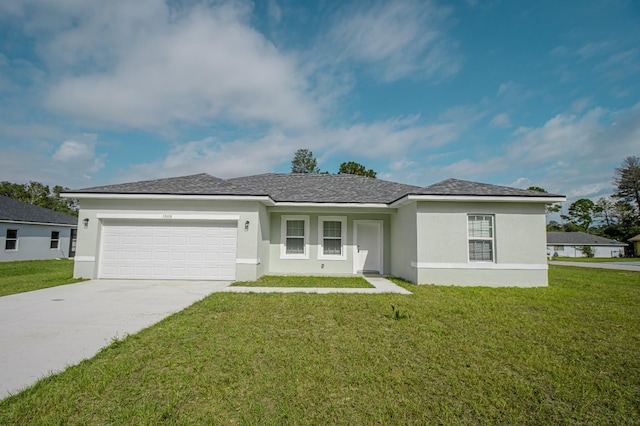 ranch-style home featuring a garage and a front lawn