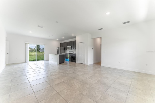 unfurnished living room featuring light tile patterned flooring